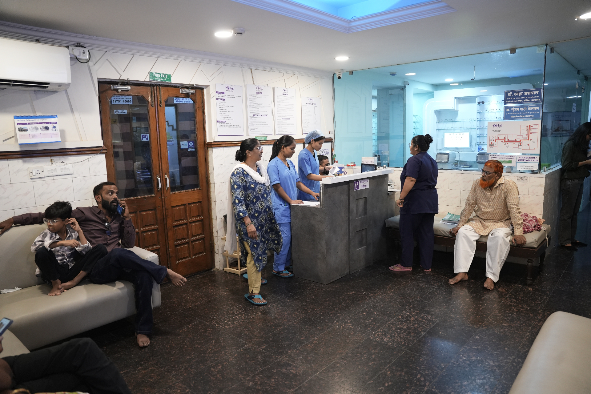 Reception lobby with patients and staff